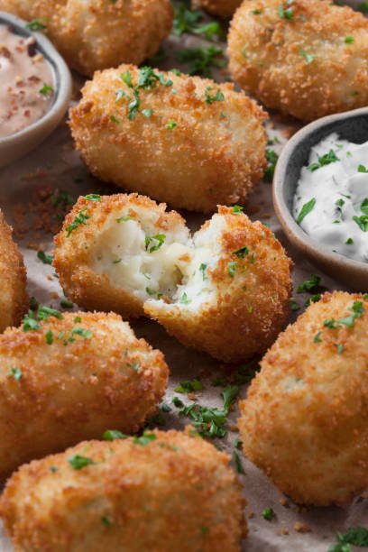 istock Creamy Mashed Potato Croquettes with Cheese and Sour Cream Dip 1266640676