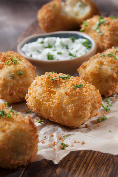 istock Creamy Mashed Potato Croquettes with Cheese and Sour Cream Dip 1266640680