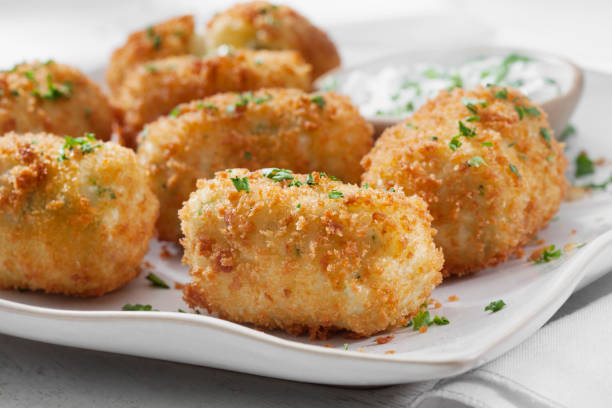 istock Creamy Mashed Potato Croquettes with Cheese and Sour Cream Dip 1266640686