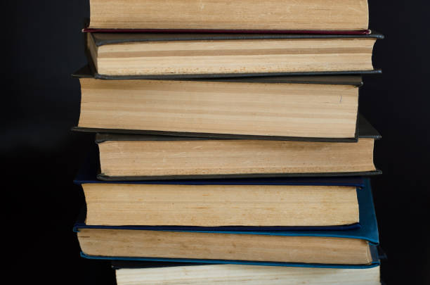 istock Lots of multi-colored books side view. Home library. 1266643413