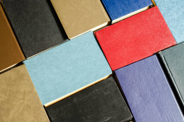 istock Books next to each other top view. Background from multicolored old books. 1266643421