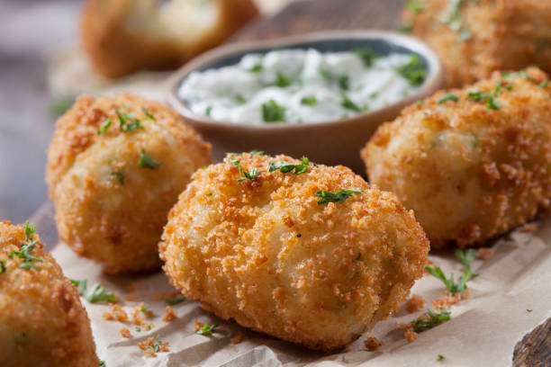 istock Creamy Mashed Potato Croquettes with Cheese and Sour Cream Dip 1266644273