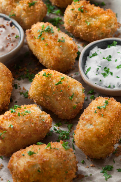 istock Creamy Mashed Potato Croquettes with Cheese and Sour Cream Dip 1266644311