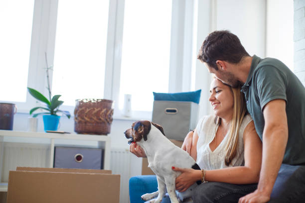 istock Young couple moving in into new apartment 1266644612