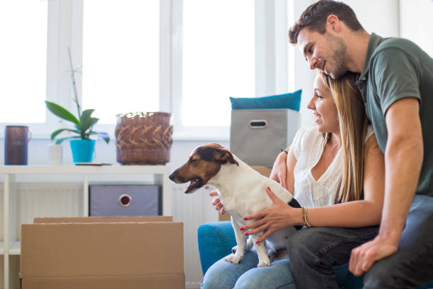 istock Young couple moving in into new apartment 1266646806