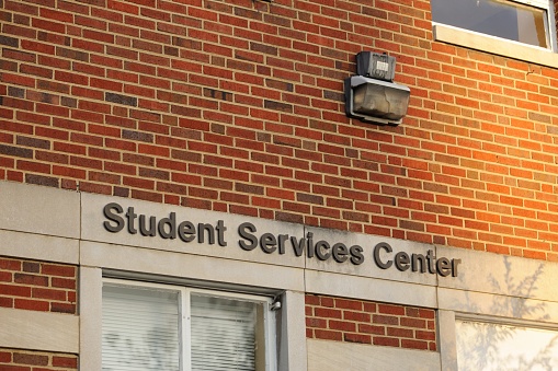 Student services sign on public university campus