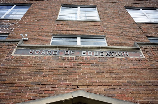 Board of education sign on building