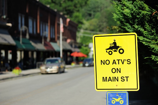 Road sign that states no all terrain vehicles on main street