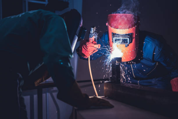 istock Metal welding steel works using electric arc welding machine 1266650313
