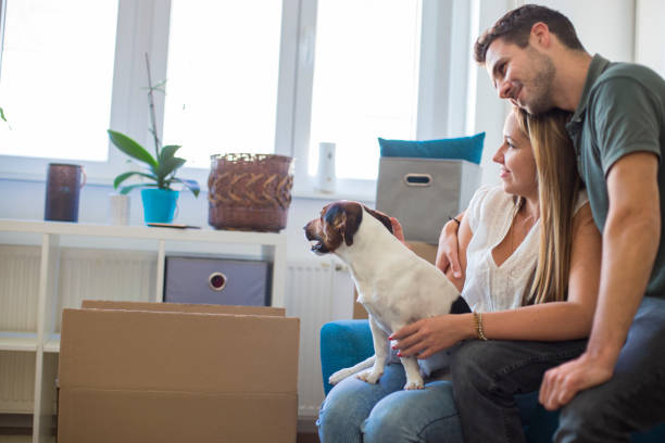 istock Young couple moving in into new apartment 1266650494