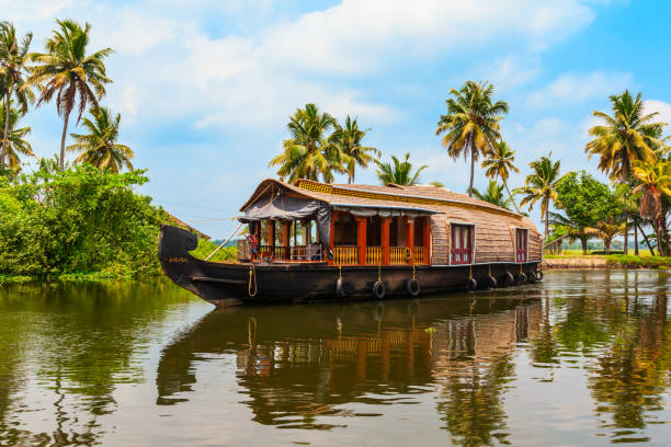 Houseboat in Alappuzha backwaters, Kerala A houseboat sailing in Alappuzha backwaters in Kerala state in India kerala south india stock pictures, royalty-free photos & images