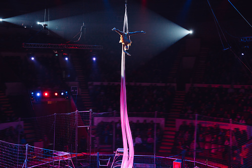 Girl's aerial acrobatics in the Circus