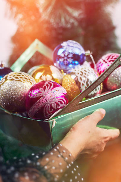 istock Son helps mom to decorate Christmas tree 1266660036