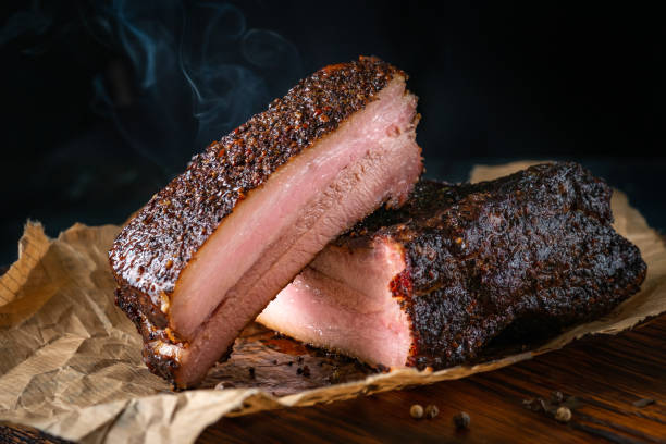 istock Sliced smoked pork brisket with dark crust from classic Texas smokehouse 1266660964
