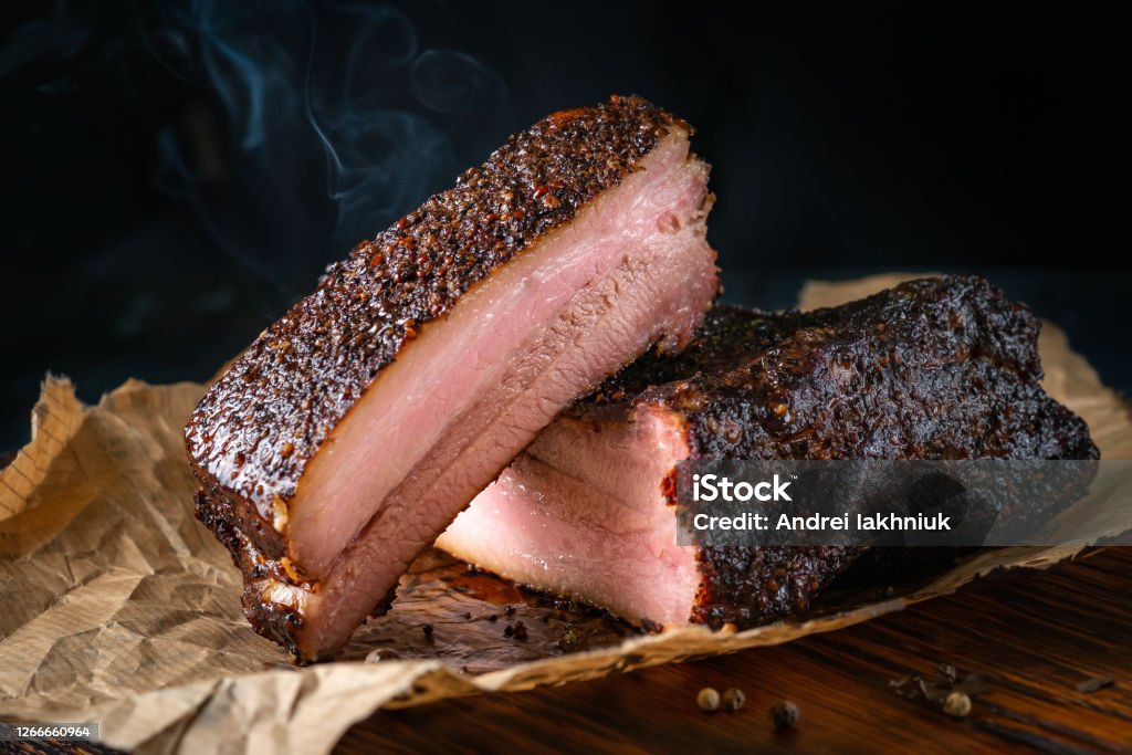 Sliced smoked pork brisket with dark crust from classic Texas smokehouse Brisket Stock Photo