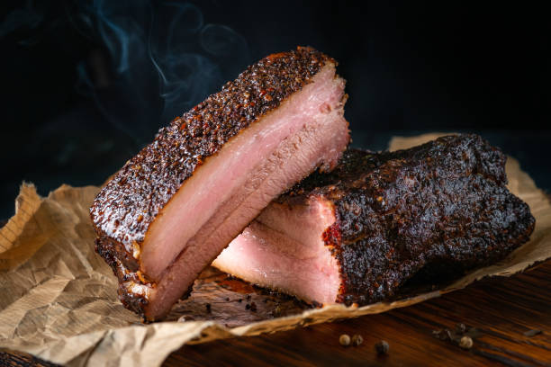 Sliced smoked pork brisket with dark crust from classic Texas smokehouse Sliced smoked pork brisket with dark crust from classic Texas smokehouse brisket photos stock pictures, royalty-free photos & images
