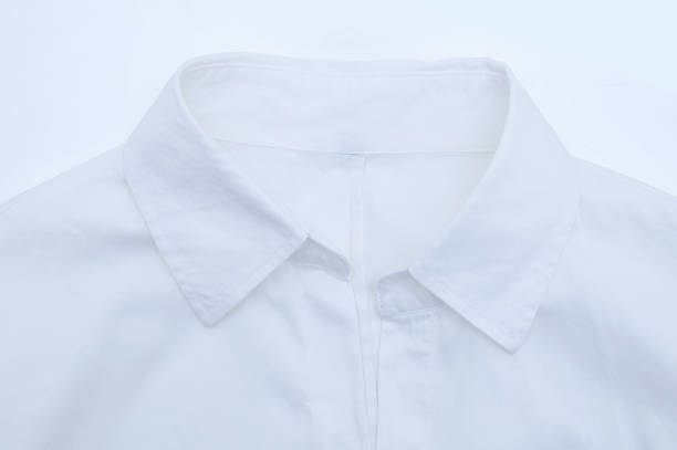 istock White women shirt with a collar close-up on a white background. 1266660978