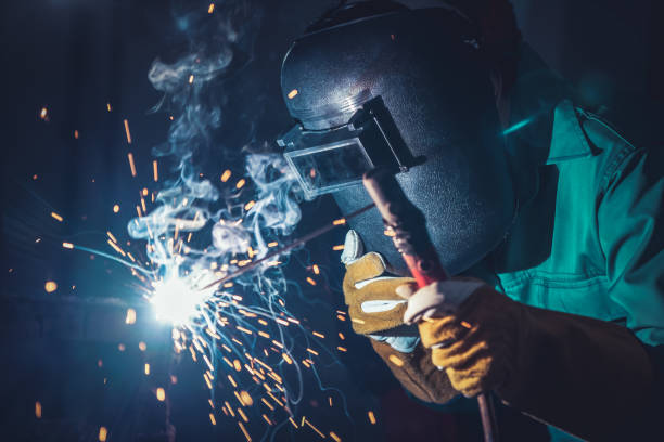 istock Metal welding steel works using electric arc welding machine 1266661677