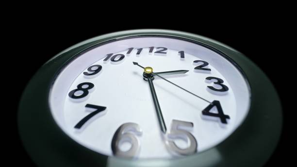 istock Simple clock dial close-up. Table business timer. Wide lens view to the time walking countdown minute. Running time concept. 1266663983
