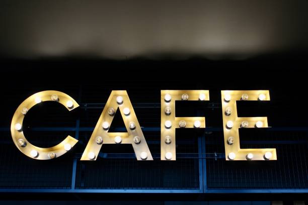 istock Yellow light cafe sign. Cafe word. 1266664038