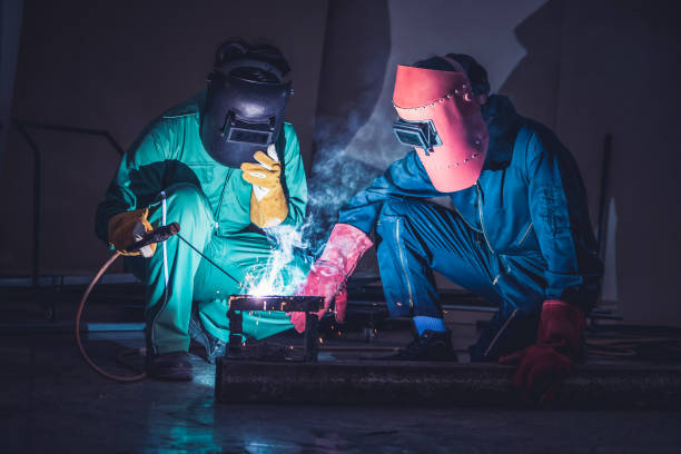istock Metal welding steel works using electric arc welding machine 1266664914