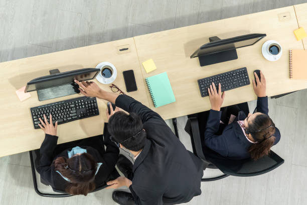 istock Business people wearing headset shot from top view 1266668273
