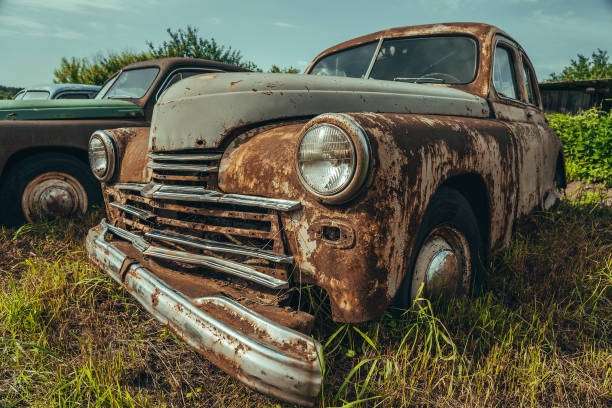 istock Old rusty retro vintage car with peeling paint close up, abandoned auto 1266669955