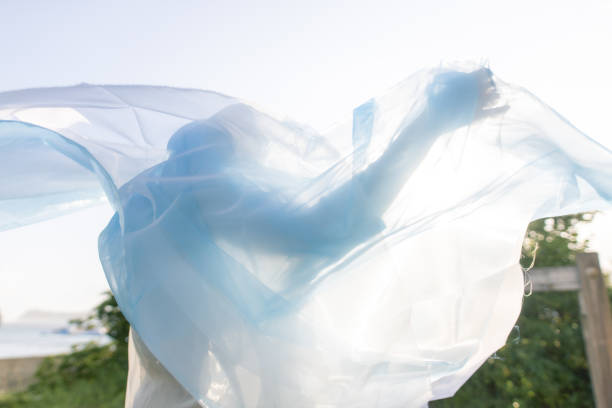 Young woman dancing with scarf