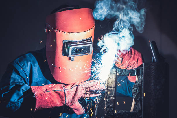 istock Metal welding steel works using electric arc welding machine 1266672259