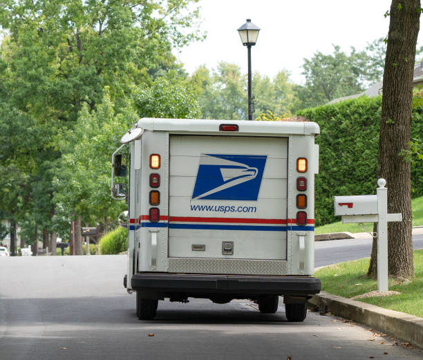 usps mail truck on suburban street - street post imagens e fotografias de stock