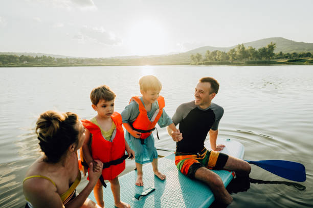 istock Learning paddling with our mom and dad 1266673155