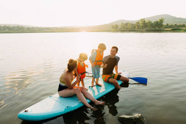 istock Learning paddling with our mom and dad 1266674058