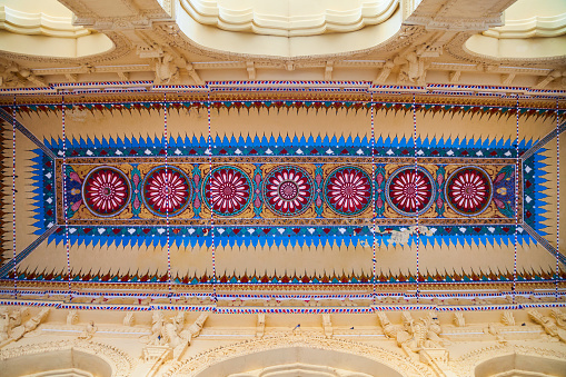 MADURAI, INDIA - MARCH 23, 2012: Floral pattern background on the ceiling of the Thirumalai Nayak Palace in Madurai city in Tamil Nadu in India