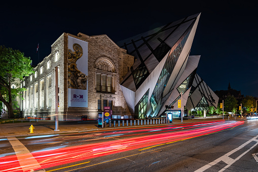 Toronto, Canada - July 8, 2020: Night view of architectural landmark Royal Ontario Museum aka the ROM in Toronto, Ontario, Canada.