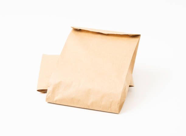 istock Brown craft paper bag for food packaging template isolated on white background. template mockup collection. 1266679987