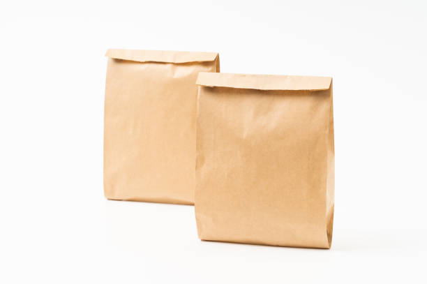 istock Brown craft paper bag for food packaging template isolated on white background. template mockup collection. 1266682037