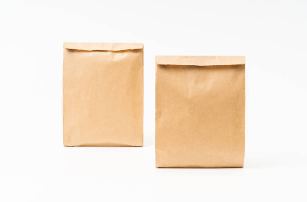 istock Brown craft paper bag for food packaging template isolated on white background. template mockup collection. 1266682081