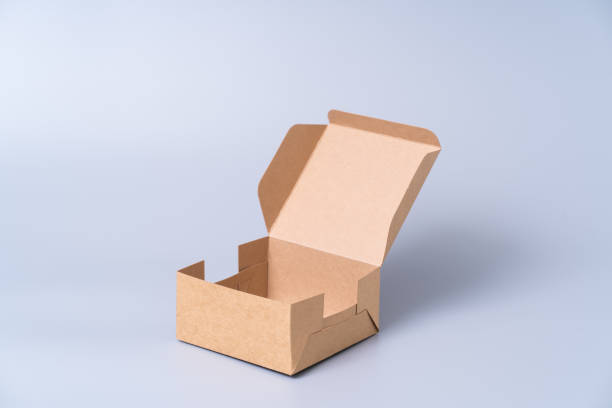istock Brown paper box for food package. carton on a grey background. 1266682865