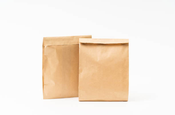 istock Brown craft paper bag for food packaging template isolated on white background. template mockup collection. 1266682910