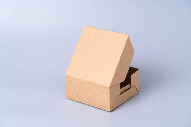 istock Brown paper box for food package. carton on a grey background. 1266683584