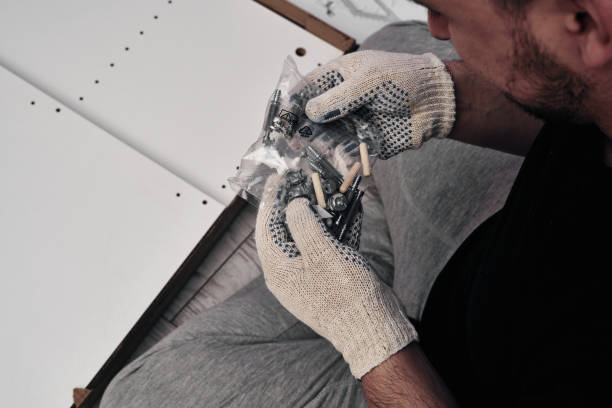 istock Furniture assembly process. Installation of fasteners and accessories. Do it yourself. 1266683980