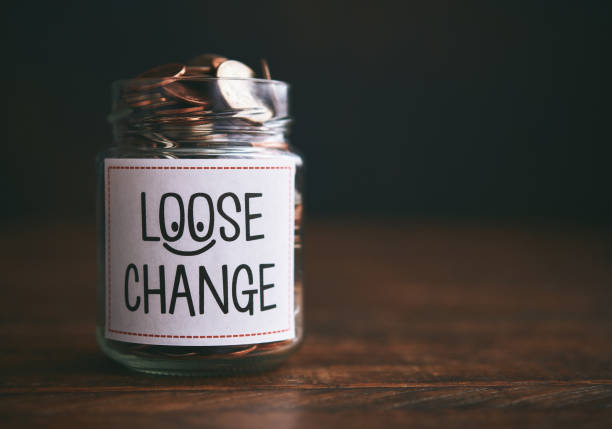 istock Loose Change Jar Filled with Coins 1266688662