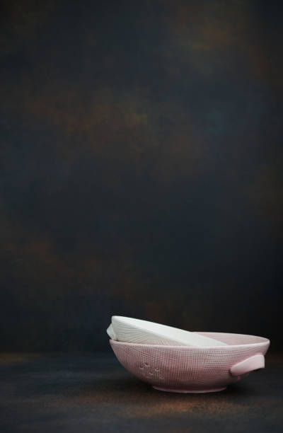 Still life arrangement with pink and white bowls