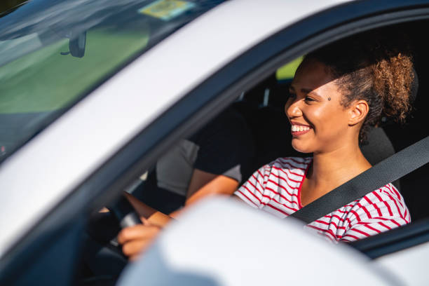 istock Close up of a confident female driver 1266692680
