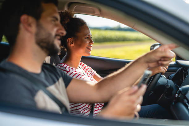 istock Couple driving in a rural area 1266692687