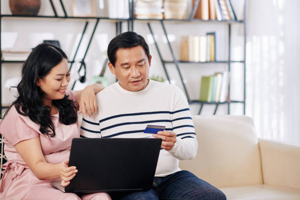 istock Mature couple shopping online 1266701918