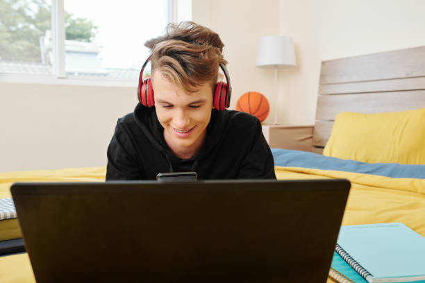 istock Texting teenage boy 1266704160