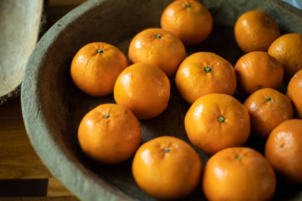 istock Oranges in the wooden tray 1266706753
