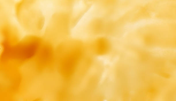 istock Abstract Sweet Caramel sauce  background. Liquid melted caramel or maple syrup texture 1266707040
