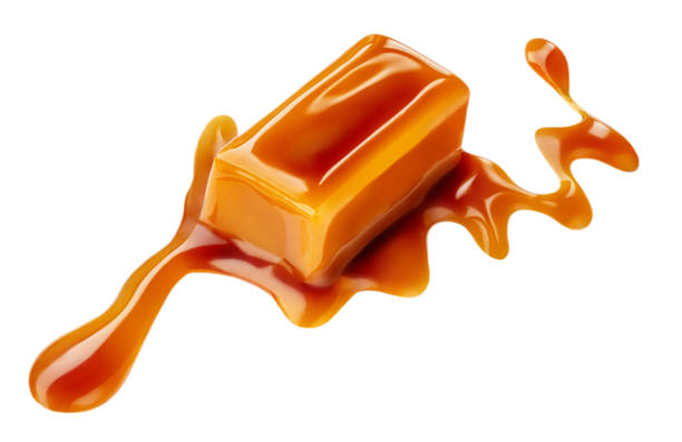 istock Soft caramel isolated on a white background. Salted melted toffee candy with caramel sauce, top view